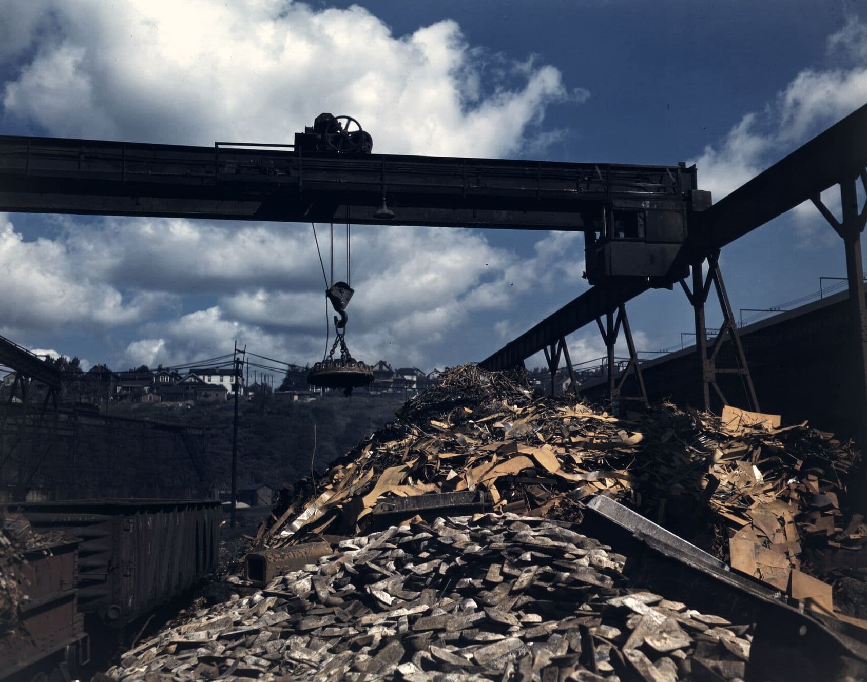 Crane magnet lifting scrap in a steel plant